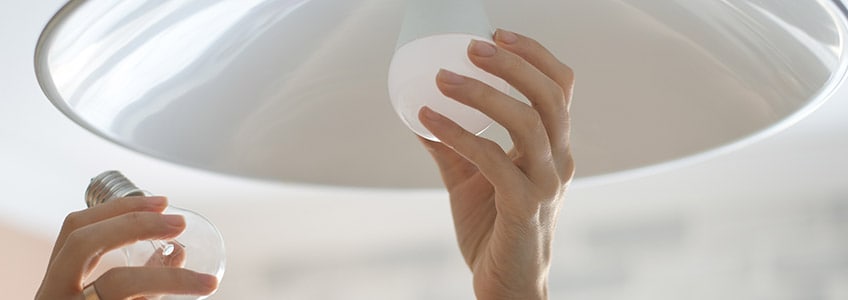 Woman Changing LED Lighbulb