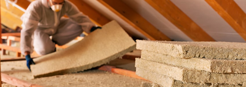 Man Laying Attic Insulation