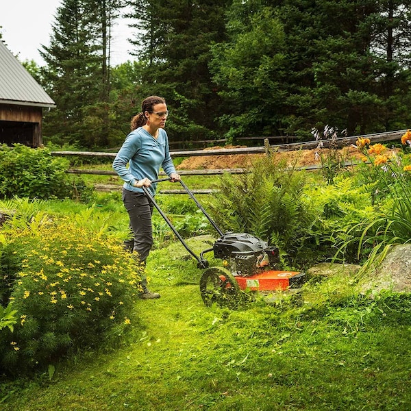 Premium Photo  Lawnmower man with string trimmer and face mask